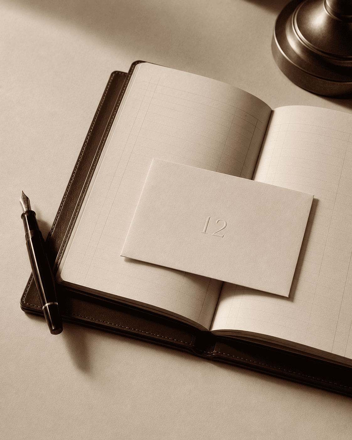 Numbered editions and a fountain pen on a leather-bound order book